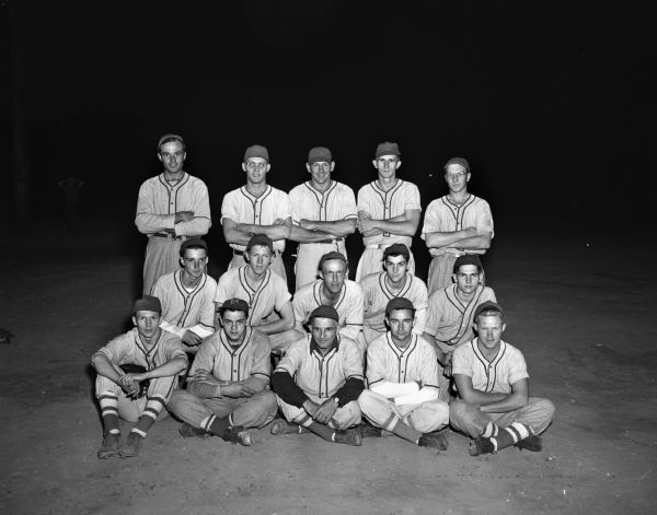 Group portrait of Penn Electric Company baseball team. The photograph was taken following their 2-1 victory over the Richland Center team, for their 23rd victory in 32 games in 1948. George Linde, first row at left, had two of the Penn team's five hits.