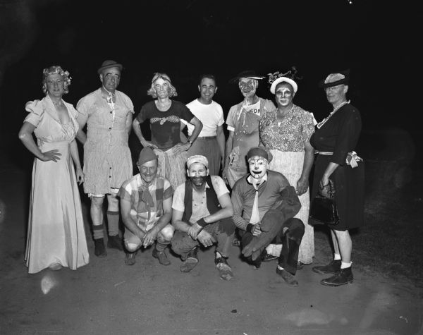 Group portrait of ten clowns in costume at the Knights of Columbus - Zor Shrine Softball Show at Breese Stevens Field.
