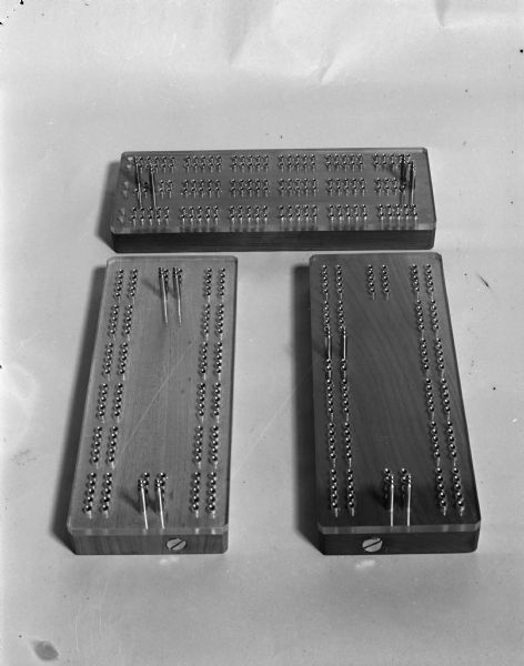 Three cribbage boards (made by Nelson?).