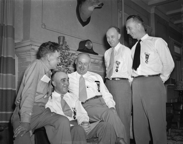 Five delegates to the Wisconsin Elks 46th annual convention at the Madison Elks Lodge. Left to right are R.W. Gustafson, Ashland; Frank T. Lynde, Antigo, state past president; Larry Gerdes, Eau Claire, state committee member; Charles R. Russell, Madison, esteemed loyal knight; and John S. Hobbins, exalted ruler of the Madison Lodge.