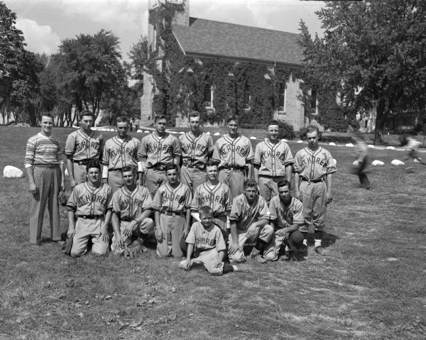 Mt. Horeb St. Ignatius baseball team, undefeated champions of the 1948 Dane County CYO League. In the background is a church.