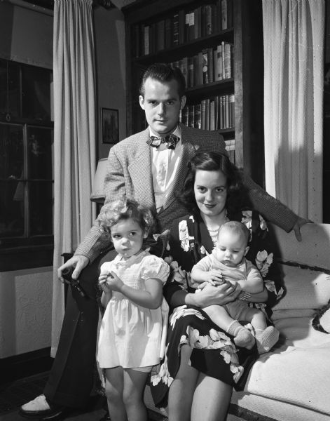 Mr. and Mrs. George E.J. Baskerville with their children, Linda Lee and George Frazier. They live in Yuma, Arizona, and are visiting his mother, Mrs. Florence Baskerville, 2642 Park Place.