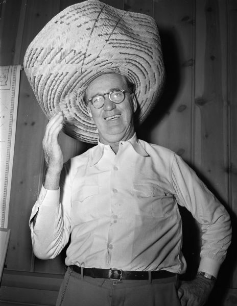 Joseph L. "Roundy" Coughlin shown wearing a large Spanish hat as the auctioneer at the West Side Business Men's Association auction to benefit the building fund for a proposed new club house and recreation center.