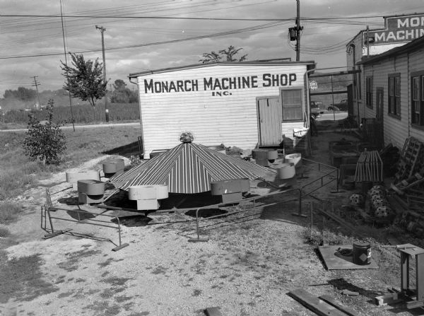 Monarch Machine Shop at 2530 Pennsylvania Avenue, with metal projects and parts in yard.