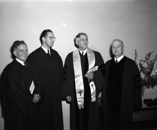Four members of the Methodist Wisconsin conference at a recognition service for their new bishop.  Pictured left to right are: Rev. W. Ross Conner, superintendent of the Southern district; Rev. James M. Buxton, superintendent of the Milwaukee district; Dr. H. Clifford Northcott, newly-elected bishop of the Wisconsin area; and Rev. Fred J. Jordan, superintendent of the Northern district.