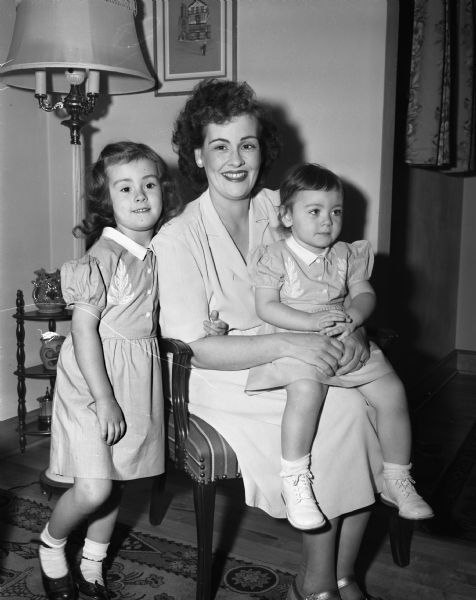 Mrs. Marjorie Worth Mathys (Mrs. Jack M.), Detroit, Michigan, with her two daughters, Susan Jane, 3, and Nancy Lou, 1, visiting at the home of her parents, 447 West Washington Avenue.