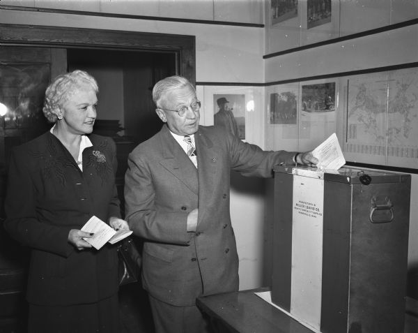 Governor and Mrs. Rennebohm casting their ballots at their home precinct in Maple Bluff. The governor was a candidate in that primary election.