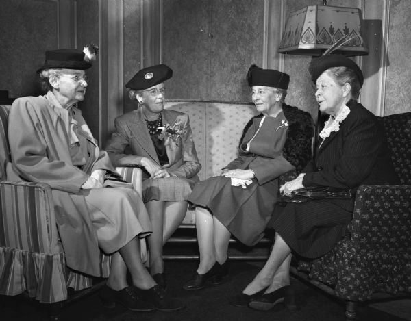 Pictured at the 60th anniversary luncheon of the Attic Angel Association, sponsors of the Madison Visiting Nurse Service, are, from left to right: Mrs. John Church Hawley, the "Evergreens," route 4; Mrs. Gilbert H. (Susan) Doane, "Fairfields," Route, Middleton; Miss Mary Stuart Foster, Madison; Mrs. Louis M. (Mary E.V.) Hanks, Madison. Mrs. Doane, who recently compiled a history of the Attic Angel Association, received valuable assistance from the three women shown with her. Mrs. Hawley has been a member of the association for 50 years; Miss Foster joined in 1894, and Mrs. Hanks joined in 1889.