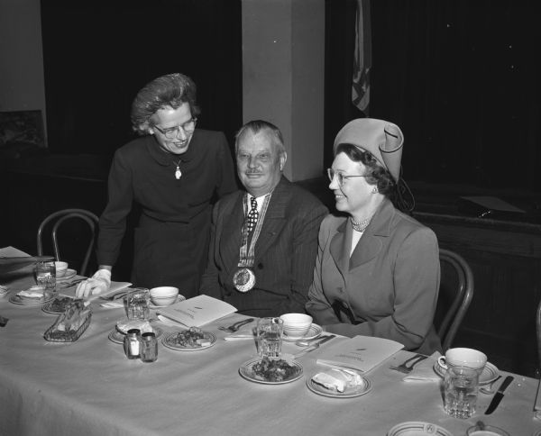 Pictured at the 60th anniversary luncheon of the Attic Angel Association, sponsors of the Madison Visiting Nurse Service, are (from left to right): Mrs. Robert L. (Sarah C.) Reynolds, new president of the association; Frederick S. Brandenburg who was made an honorary member of the organization because of his many services to the group;  Mrs. V.W. (Alice) Meloche, the retiring president.