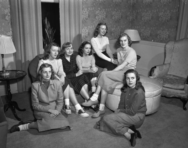 The following University of Wisconsin Madison students pledged Alpha Phi. Left to right: Joan Bratt, daughter of the R.O. Bratts; Sally Kellogg, daughter of Mr. and Mrs. Fred C. Kellogg; Luanne Dreher, daughter of Dr. and Mrs. J.S. Dreher; Joanne Conlin, daughter of Mr. and Mrs. J.M. Conlin; Mary Kay Brader, daughter of Mr. and Mrs. I.G. Brader; JoAnn Forster, daughter of Mr. and Mrs. George Forster; and Nancy Lange, daughter of Mr. and Mrs. George F. Lange.