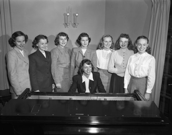 Kappa Delta Madison student pledges are as follows: seated at the piano, Terry De Fazio. Standing left to right: Annette Koss, Karen Ragatz, Nola Mockrud, Jean Brigham, Sally Sawtelle, Shyrle Webster, and Jo Clapp. Marcia Varney and Mary Lee Fix were absent when the picture was taken.