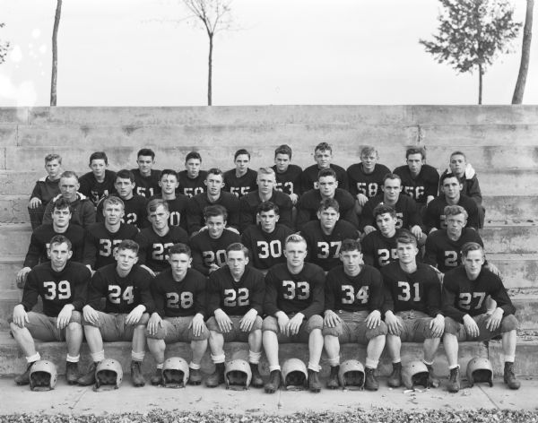 Group portrait of the Sun Prairie high school football team, winners of the Madison Suburban League title. It is the sixth time that a Cardinals" team has finished atop the standings in the nineteen years the circuit has been in existence.