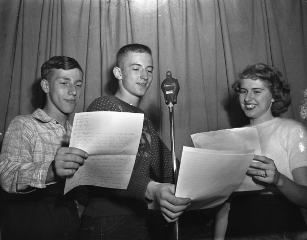 One of several radio programs produced by Madison teenagers is the Teen Colony on WKOW every Saturday morning. Another program is the Hy Time, every Monday through Friday at 5:30 over WKOW. The 15-minute shows consist of music and news from one of the five high schools in Madison. Lester Levine, East High School, Robert Cnare of East, and Dorothy Rae Stanley, Wisconsin High, as they rehearse for one of the youth radio programs.