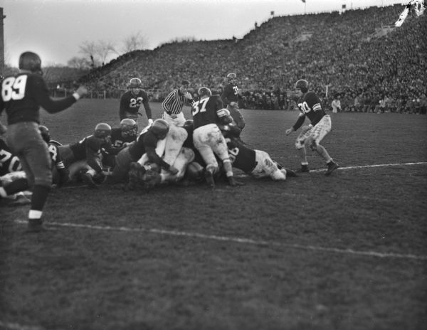 University of Wisconsin football player, Wally Dreyer, is shown making a touchdown during the Wisconsin-Northwestern homecoming game.