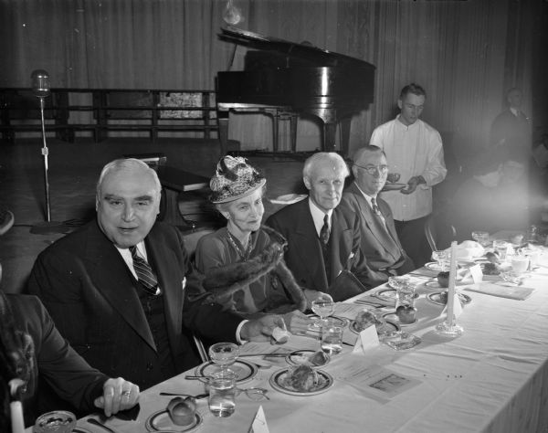 People at the speakers' table at the dinner marking the start of the University of Wisconsin's foundation's centennial campaign. From left are Herbert V. Kohler, state chairman of the foundation; Mrs. William Kiekhofer; Prof. Kiekhofer; and Dean John Guy Fowlkes.
