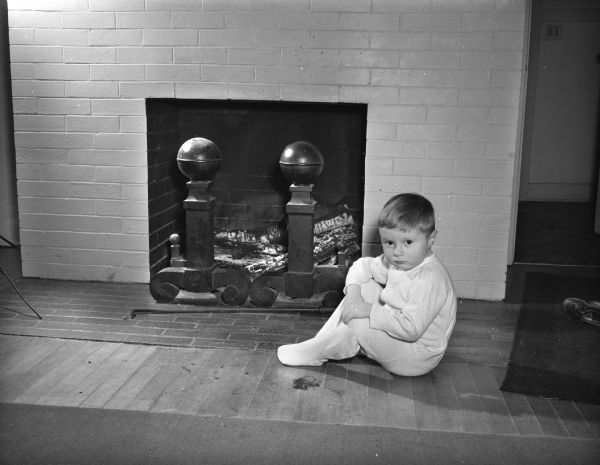 "Chuckie," a 3-year-old who has spent most of the past year as a patient at the Morningside Tuberculosis Sanatorium near Madison. He closely resembles the boy on the 1948 Christmas seal and therefore posed for this photograph at the sanatorium.