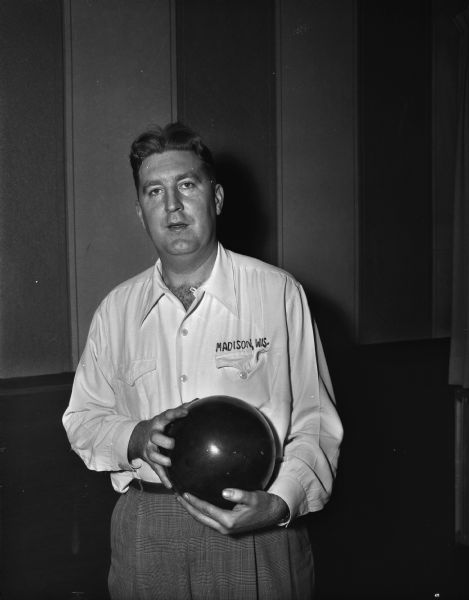 Unidentified Madison bowler holding his bowling ball.