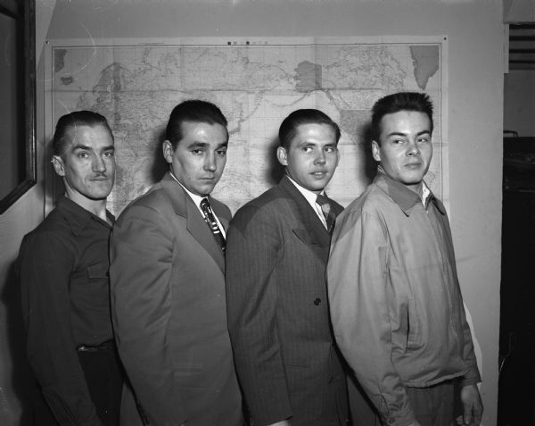The first Madison draftees under the new selective service law who were inducted. Left to right are: Dean Raemisch, James Everhart, Norman Chump and Carl Wenz.