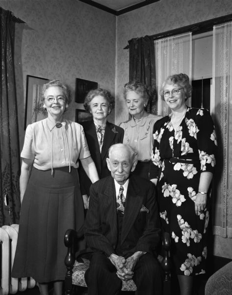 Group portrait of an old man and four older adult women (his daughters ?). Perhaps the Cooper family.