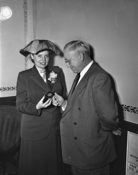 Governor Oscar Rennebohm was honored by the citizens of Vienna, Austria, for Wisconsin citizens' contributions to the "American Silent Guest committee" of food and clothing for needy European children. A medal was presented to the Governor by Iris Gabriel, director of the Silent Guest committee. It is part of the United Nations appeal for children.