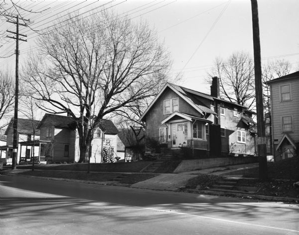 Houses on the south side of the 2100 block of University Avenue. The address on the entrance at the far right is 2125.