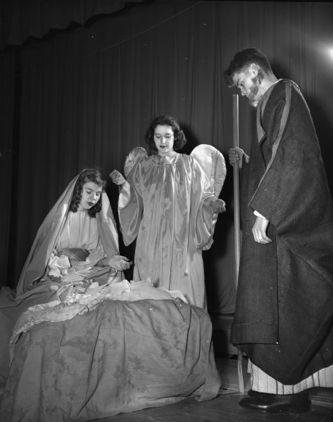 Three high school students dressed as Joseph, Mary and the Angel Gabriel, rehearsing for a Christmas play to be presented at the Edgewood High School auditorium. Left to right: Mary Lou Devine, Rita Fose, and James Dammen.
