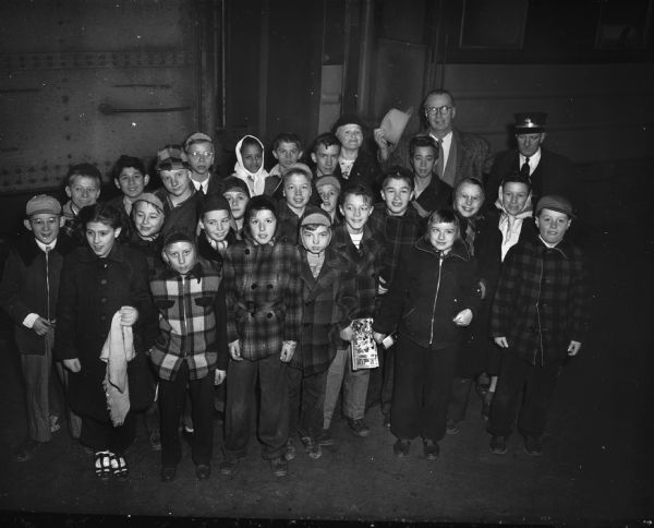 Roundy's Fun Fund and the Milwaukee Road provided forty children from the remedial department of the Madison public schools with their first train ride to Janesville. Riding in a brand new deluxe coach, they enjoyed refreshments and a lunch. Their escorts were: Carl Waller, superintendent of the schools handicapped children department; Rufus F. Wells, Fun Fund committee chairman, and Mrs. Wells; Bernard Gill committee secretary and Mrs. Gill; Mrs. Edith Goodman, Roundy Coughlin's secretary; three teachers; the railroad's district passenger agent and two uniformed railroad police officers.