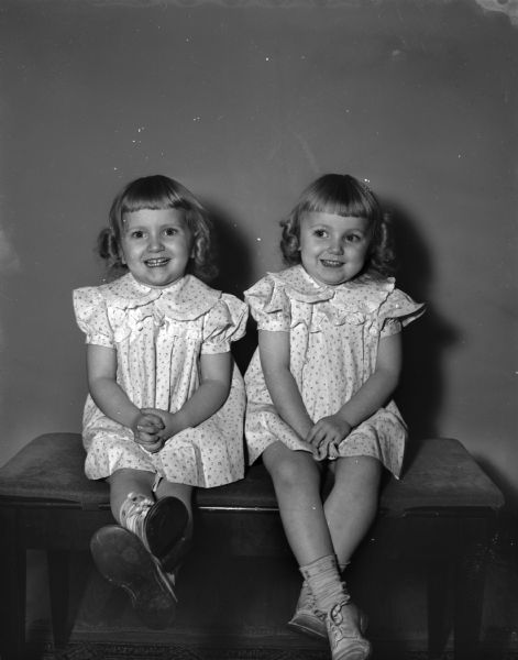 Christmas pose of Linda and Marcia Jones, twin daughters of Edwin and Mary Jones, 4101 Hillcrest Drive.