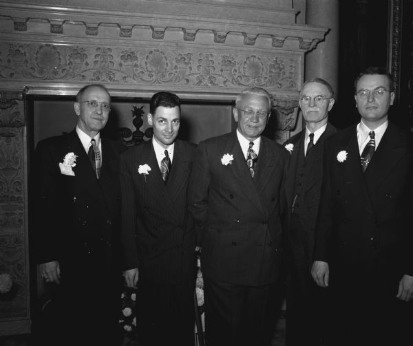 Five state constitutional officers take their oaths of office at the Wisconsin State Capitol. Left to right: Warren R. Smith, State Treasurer; George M. Smith, Lieut. Governor; Oscar Rennebohm, Governor; Fred. R. Zimmerman, Secretary of State; and Thomas E. Fairchild, Attorney General.