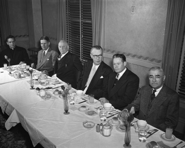 Retired Police Chief William H. McCormick was honored by his friends and associates at a testimonial dinner at the Elk's Club. Seated at the table (left to right) are the Rev. Arnold J. Lehman of St. Bernards Catholic Church; City Manager Leonard Howell; McCormick; Joseph "Roundy" Coughlin; Police Chief Bruce Weatherly; and Dr. Oscar F. Meng.