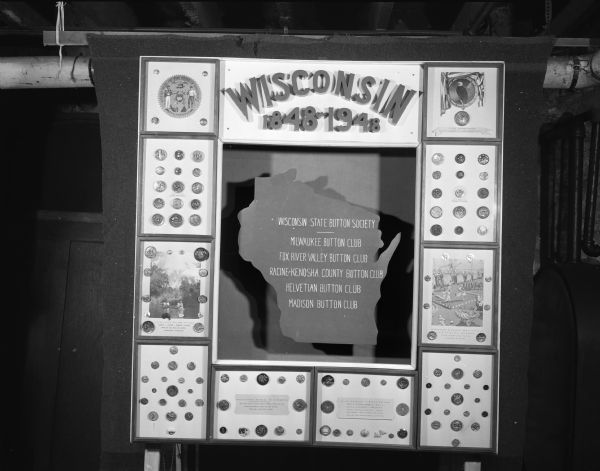 Bulletin board for the Wisconsin State Button Society, with the names of five member clubs and button displays.