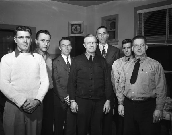 Six "old hands" of Fire Station No. 4 at a banquet for their chief, Roy B. Herrling. From left are, Fred Rice, Phillip Behrend, Wilson Donkle, Captain Herrling, Maurice Nason, John Huston, and Joseph Kervin.
