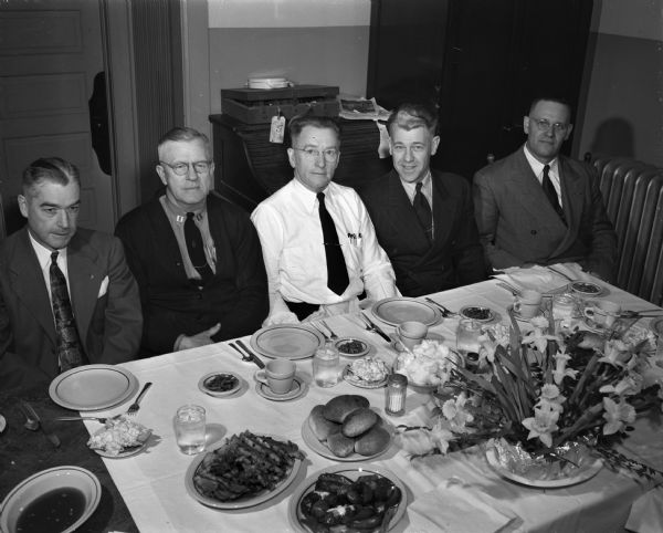 Guests at the head table at a banquet for Fire Captain Roy B. Herrling held at the No. 4 station. From left are, Chief Edward J. Page, Captain Herrling, Assistant Chief S.A.C. Ratcliffe, Captain Arthur Emerson, and Lieutenant Glover Peterson.