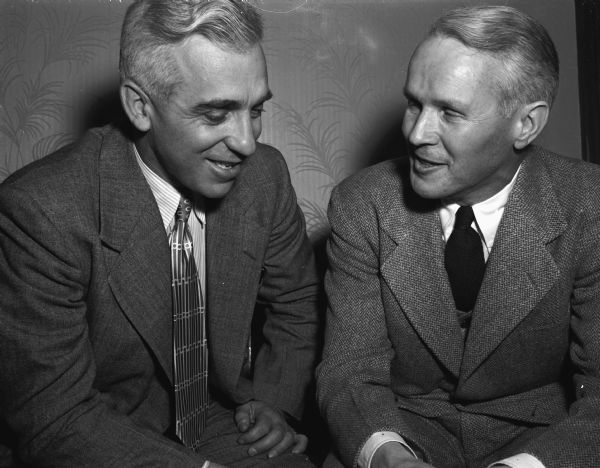 Charles "Rip" Engle of Brown University, left, conferring with Dr. Willilam B. Sarles, chairman of the Wisconsin Athletic Board. Engle is being considered for the head football coach position.