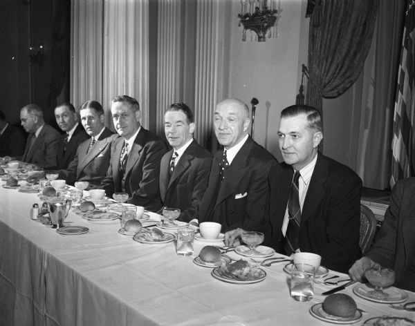 Guests at the speakers table at the 15th Annual East Side Business Men's Association banquet sponsored by the Security State Bank at the Hotel Loraine. Left to right are: Alf Peterson, vice-president of the bank; City Manager Leonard Howell; Ray Sennett, cashier of the bank; David Dillman, main speaker; L.L. Lunenschloss, bank president; and John Fahning, president of the business association.