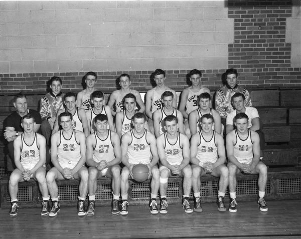 Edgewood High School basketball team. Pictured are, left to right, front row: Jack Statz, Dean Corcoran, Norbert Esser, Don Schaefer, Don Zach Jack Leichtenberg, and Dave Brown. In the second row are: coach Earl Wilke, Carl Maglio, Roy Berigan, Bob Erickson, Del Littel, Tom Schwoegler, and assistant coach Walter Heilman. In the back row are: manager John Gill, Eddie McNamara, Greg Caine, Dick Yoachim, Cliff Roelke, and manager John Oesterle.