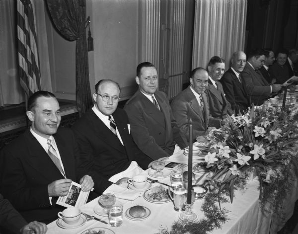 The 33rd anniversary banquet of the Credit Bureau of Madison held at the Hotel Loraine. Shown are, left to right: H.R. Heberlein, past president; K.W. Haagensen, public relations director for Allis-Chalmers and main speaker; J.K. Gill, president; R.F. "Pat" Norris, toastmaster; City Manager Leonard Howell; and Col. J.W. Jackson, executive director of the Madison and Wisconsin Foundation.