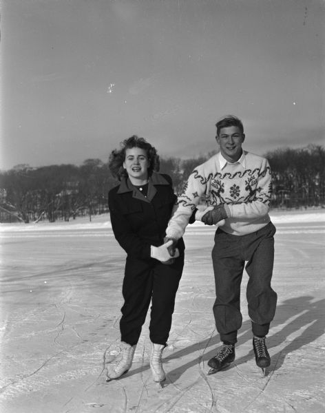 Winter scene with Dick Roberts and Mary Lita Jensen, West High School students (Madison, Wisconsin), ice skating.