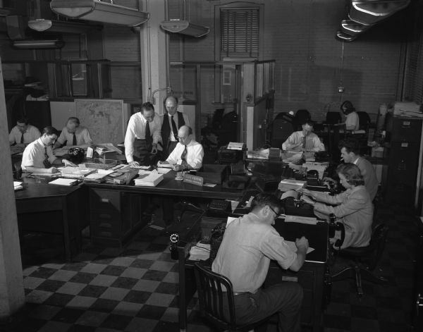 Elevated view of part of the City Room with staff, "Wisconsin State Journal".