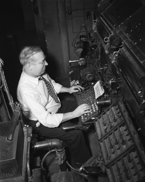 Julian Swan at work with a linotype machine.