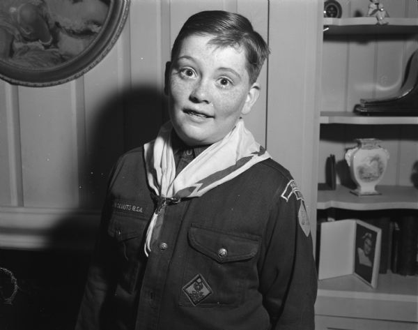 John Cavanaugh Jr., wearing cub scout uniform, won first place in the "Wisconsin State Journal's" second "Know These Badgers" contest. He won $3.