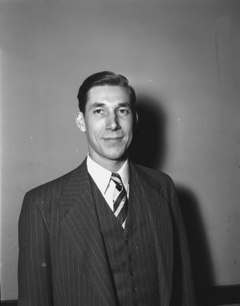 Don Trachte, an actor in Madison Theater Guild's production of "The Hasty Heart," in his role as a "knitting Australian." Also included is a second negative of a portrait of the actor in street clothes.