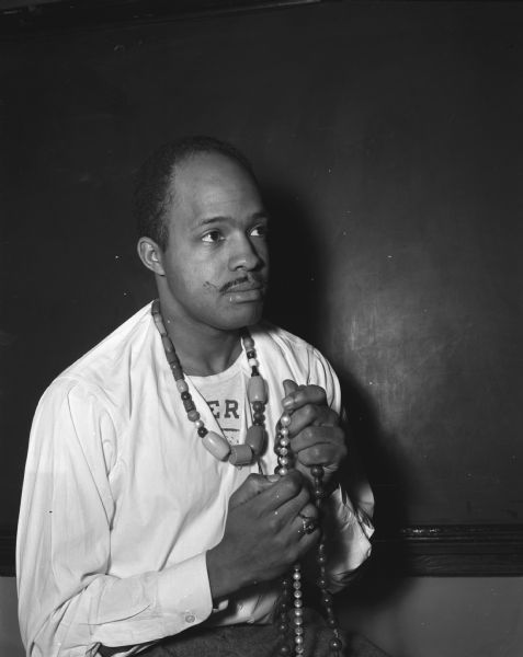 Conrad Harris, St. Louis, in his role as Blossom in Madison Theater Guild's production of "The Hasty Heart." Also included is a second negative of a portrait of the actor in street clothes.