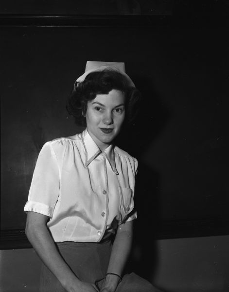Marilyn Eddy as Margaret, a nurse in a British hospital in Burma, in Madison Theater Guild's production of "The Hasty Heart". Also included is second negative of a portrait of the actress in street clothes.