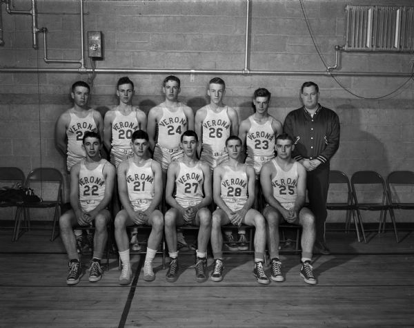 A group portrait of ten Verona High School basketball players, and their coach, Harry Scott.
