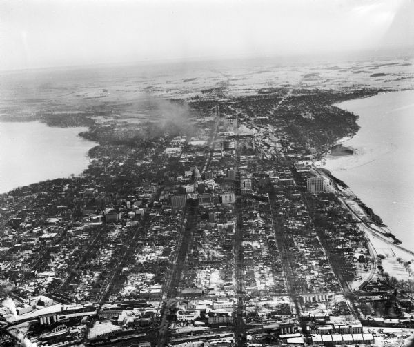 Aerial view of Madison, looking east across the Isthmus including the Wisconsin State Capitol, Lake Mendota, and Lake Monona.