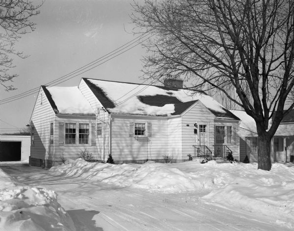 Exterior view from driveway of the Edward. B.A. Sokoloski residence in the snow at 874 Woodrow Street.