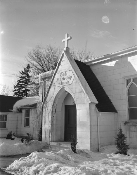 Exterior view of Madison Bible Fellowship Church in the snow, 1704 Roberts Court. (Now Society of Friends, Quaker meeting house.)