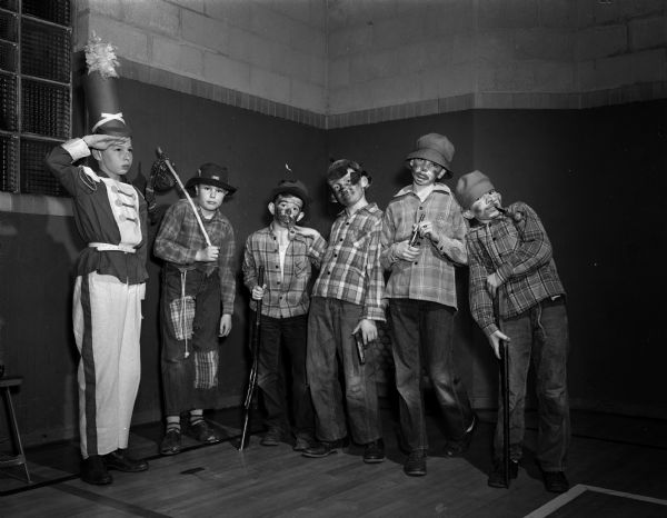 Members of Ethlyn Jefferds' dancing class, fifth and sixth grade students from Shorewood, Randall, and Lakewood schools, attending their first costume ball. Right to left are Tommy Thompson, dressed as a toy soldier; and his "recruits," Philip Brown, Howie Goldberg, John Cartwright, and John and Dick Meloy.