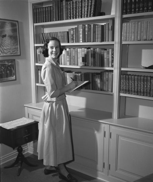 Diana Dean, Maple Bluff, a student at Wisconsin High School, modeling a corded cotton dress perfect for a high school girl.